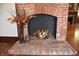 Cozy brick fireplace with hearth features fall floral arrangement at 189 S Jefferson St, Martinsville, IN 46151
