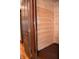 Hallway features wood paneled walls, wood floors, a doorway and a glimpse of stairs at 189 S Jefferson St, Martinsville, IN 46151