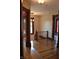 Upstairs hallway showing hardwood floors and decorative trim detail between rooms at 189 S Jefferson St, Martinsville, IN 46151