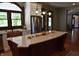 Bright kitchen featuring white cabinets, granite countertops, stainless steel appliances, kitchen island and hardwood floors at 189 S Jefferson St, Martinsville, IN 46151