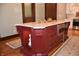 Close up of kitchen island with stone countertops, stainless steel microwave, and custom cabinets at 189 S Jefferson St, Martinsville, IN 46151