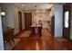 Spacious kitchen with a center island, custom cabinets, stainless steel appliances, and hardwood flooring at 189 S Jefferson St, Martinsville, IN 46151