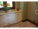Bright cabinets in the laundry room create storage spaces at 189 S Jefferson St, Martinsville, IN 46151