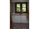 The laundry room features bright cabinets and view to the exterior at 189 S Jefferson St, Martinsville, IN 46151