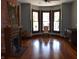Inviting living room with hardwood floors, decorative fireplace, and bay windows at 189 S Jefferson St, Martinsville, IN 46151