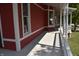 Home featuring a long porch and views of the yard at 189 S Jefferson St, Martinsville, IN 46151