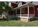 Covered porch with decorative railing and ample space for outdoor seating at 189 S Jefferson St, Martinsville, IN 46151