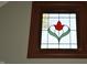 Close up of decorative window with stained-glass flower accent at 189 S Jefferson St, Martinsville, IN 46151