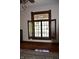Stained glass tops a window with dark wood trim, and open view to outside at 189 S Jefferson St, Martinsville, IN 46151