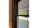 View out the window to the front yard from the kitchen featuring white pillars on the front porch at 189 S Jefferson St, Martinsville, IN 46151