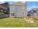 Spacious backyard with healthy green grass, small porch and basement entrance at 2031 Central Ave, Indianapolis, IN 46202
