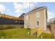 Large backyard featuring a grassy area with side access to the house at 2031 Central Ave, Indianapolis, IN 46202