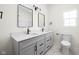 Bathroom with double vanity, granite countertops, black fixtures, and neutral color palette at 2031 Central Ave, Indianapolis, IN 46202