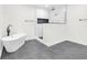 Bright bathroom featuring a tub, glass shower, gray tile floors, and crisp white walls at 2031 Central Ave, Indianapolis, IN 46202