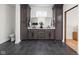 Bright bathroom featuring a double vanity with white marble countertops and black fixtures at 2031 Central Ave, Indianapolis, IN 46202