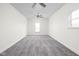 Spacious bedroom showcasing neutral carpet, bright white walls, and ample natural light at 2031 Central Ave, Indianapolis, IN 46202