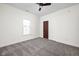 Cozy bedroom featuring plush carpeting, a ceiling fan, and a window for natural light at 2031 Central Ave, Indianapolis, IN 46202