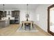 Bright dining room featuring a wooden table with seating for six and modern decor at 2031 Central Ave, Indianapolis, IN 46202