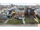 Aerial view of a two-story brick home with manicured front yard in a residential neighborhood at 2031 Central Ave, Indianapolis, IN 46202