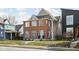 Attractive two-story brick home with a well-kept lawn and inviting curb appeal in a neighborhood setting at 2031 Central Ave, Indianapolis, IN 46202