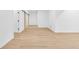 Hallway featuring wood-look vinyl plank flooring, sliding barn doors and neutral walls at 2031 Central Ave, Indianapolis, IN 46202