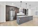 This kitchen features a gray island, stainless steel appliances, and a sleek, modern design at 2031 Central Ave, Indianapolis, IN 46202