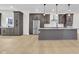 A bright kitchen boasts stylish gray cabinetry, stainless appliances, and an open, airy layout at 2031 Central Ave, Indianapolis, IN 46202