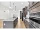 Modern kitchen featuring stainless steel appliances and a granite countertop island at 2031 Central Ave, Indianapolis, IN 46202