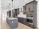 Modern kitchen featuring stainless steel appliances, and a marble countertop island at 2031 Central Ave, Indianapolis, IN 46202