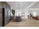 Spacious kitchen with stainless steel appliances, a central island, and seamless flow to living area at 2031 Central Ave, Indianapolis, IN 46202