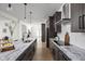 Spacious kitchen with a marble island, stainless steel appliances, and dark wood cabinets at 2031 Central Ave, Indianapolis, IN 46202