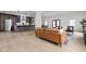 Spacious living area with a modern kitchen featuring stainless steel appliances and counter seating at 2031 Central Ave, Indianapolis, IN 46202