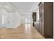 A spacious living room features light hardwood floors and a convenient wet bar at 2031 Central Ave, Indianapolis, IN 46202