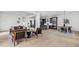 Open concept living room seamlessly connects the kitchen and dining areas with light wood flooring at 2031 Central Ave, Indianapolis, IN 46202
