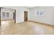 A versatile living area with bright hardwood floors, a window, and neutral colors at 2031 Central Ave, Indianapolis, IN 46202