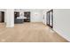 Spacious living room featuring wood floors and doors leading to the exterior at 2031 Central Ave, Indianapolis, IN 46202