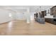 Open-concept living space with hardwood floors and a kitchen with a center island at 2031 Central Ave, Indianapolis, IN 46202