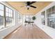 Bright office with a ceiling fan, wood ceiling, many windows and a desk and chair at 2031 Central Ave, Indianapolis, IN 46202