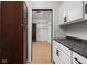 Walk-in pantry featuring wood countertops, white cabinetry, and a well-organized shelving system at 2031 Central Ave, Indianapolis, IN 46202