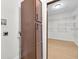 Walk-in closet adjacent to storage cabinets with wood floors and organized shelving system at 2031 Central Ave, Indianapolis, IN 46202