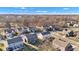 An aerial view showcases well-maintained homes in a desirable neighborhood, surrounded by trees and manicured lawns at 281 Dovetree Dr, Danville, IN 46122