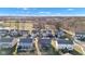 An aerial view showcases well-maintained homes in a desirable neighborhood with a lush, green landscape under a bright blue sky at 281 Dovetree Dr, Danville, IN 46122