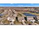 Aerial view of a suburban neighborhood featuring well-maintained homes and a scenic pond on a sunny day at 281 Dovetree Dr, Danville, IN 46122