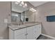 Bathroom features a dual sink vanity with a granite countertop, tiled floors, and modern fixtures at 281 Dovetree Dr, Danville, IN 46122