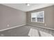 Neutral bedroom featuring plush carpeting, and a sunlit window at 281 Dovetree Dr, Danville, IN 46122