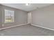 Bedroom featuring plush carpeting, a sunlit window overlooking the outdoors at 281 Dovetree Dr, Danville, IN 46122