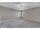 A cozy bedroom with neutral walls, plush carpeting, and a ceiling fan offering a peaceful retreat at 281 Dovetree Dr, Danville, IN 46122
