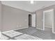 An empty bedroom features plush carpeting, neutral paint, and natural light from window blinds at 281 Dovetree Dr, Danville, IN 46122