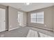 An empty bedroom features plush carpeting, neutral paint, and natural light from window blinds at 281 Dovetree Dr, Danville, IN 46122
