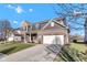 Exterior view of a two-story brick home with a two-car garage and concrete driveway leading up to it at 281 Dovetree Dr, Danville, IN 46122